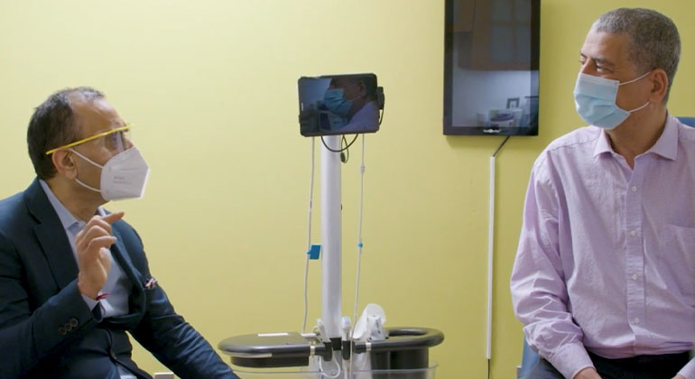 image of patient and doctor in an exam room